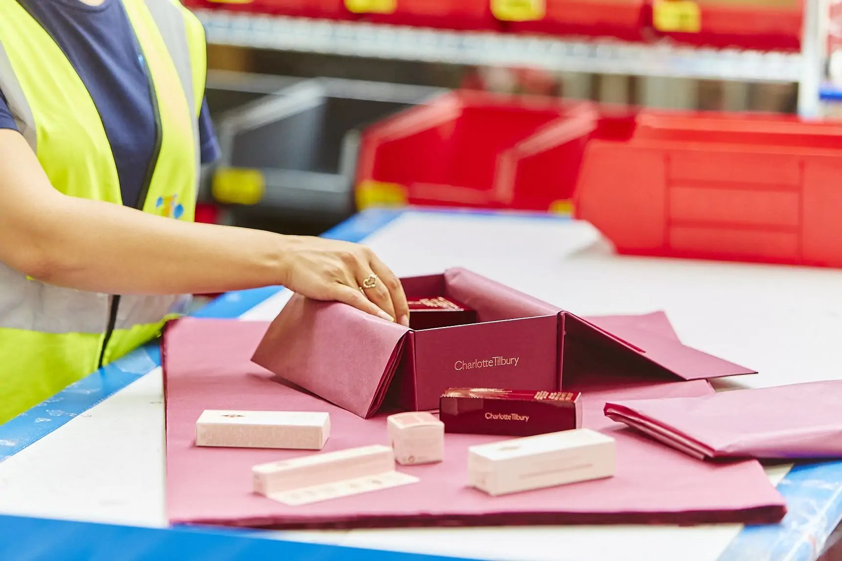 Packing Charlotte Tilbury products in warehouse
