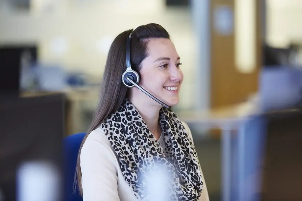 Girl wearing headset in office