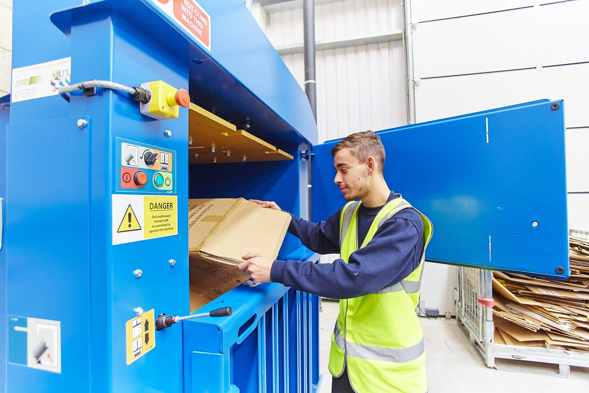 Cardboard being put into baler