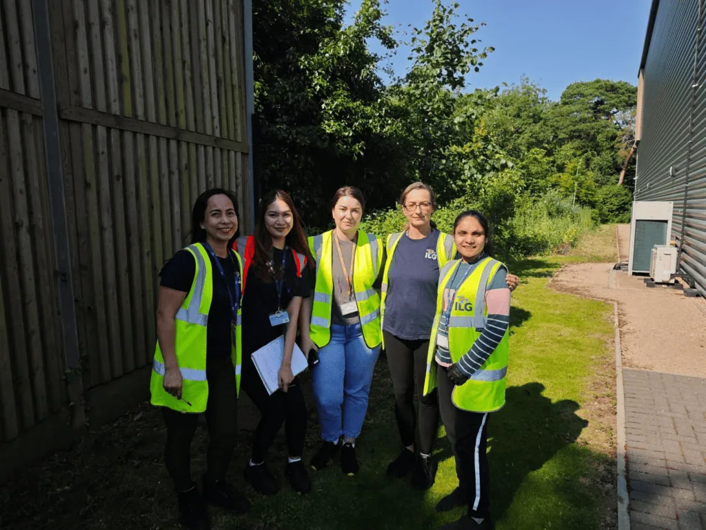 ILG staff outside warehouse