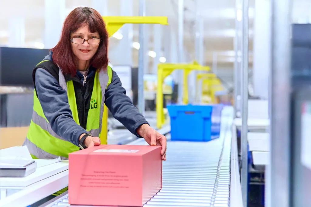woman sending packed box off to be shipped