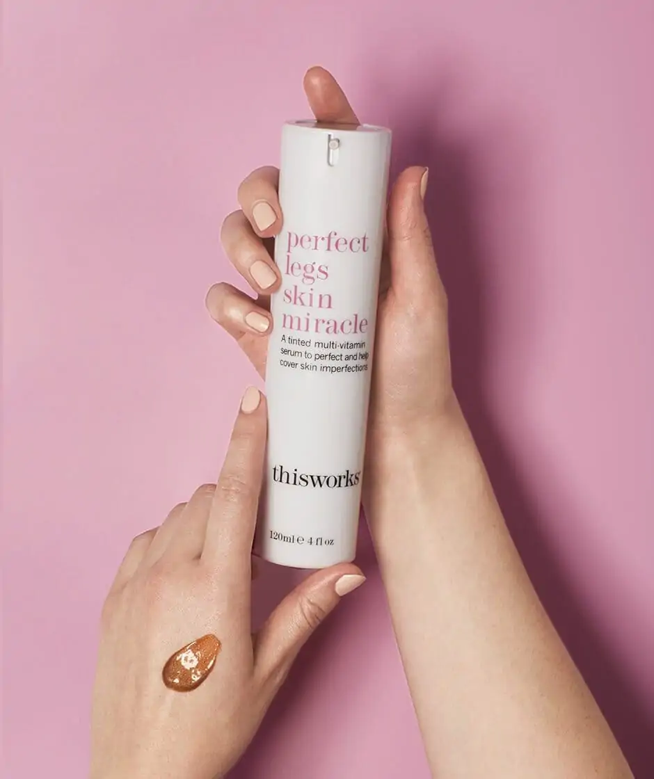 this works perfect legs skin miracle being shown by a pair of hands