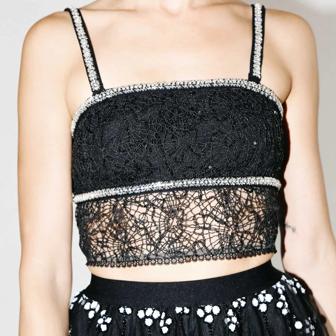 a model wearing a black self portrait top