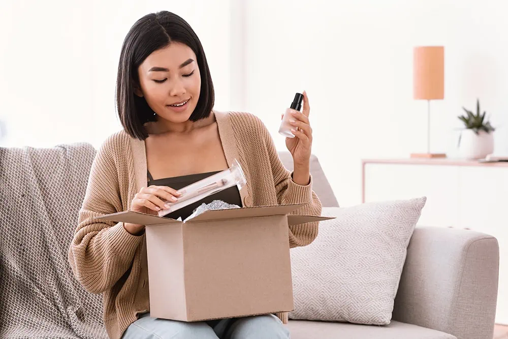Woman unboxing beauty products