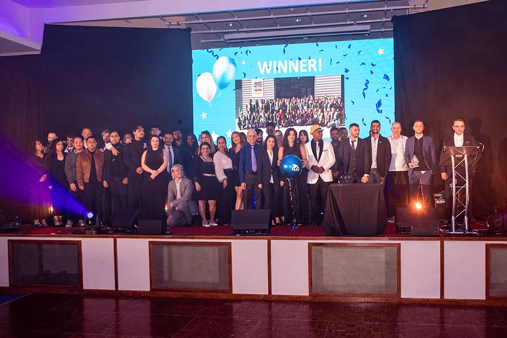 Salfords team accepting award on stage