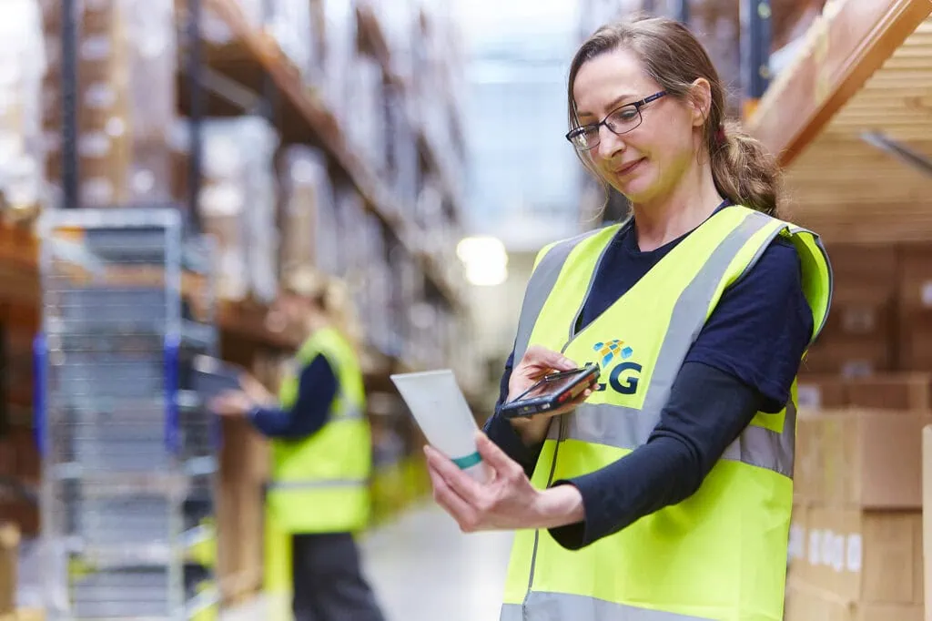 lady scanning a product in a warehouse