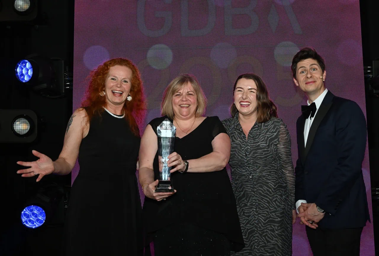 Helen and Chloe accepting award on stage