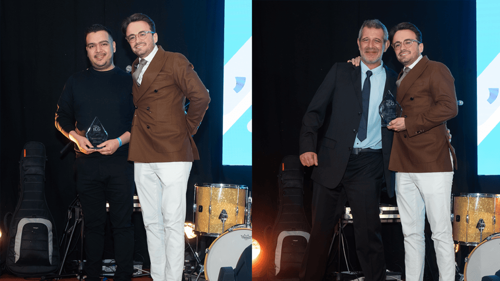 Clayton Goosen and Cesar Rodrigez accepting award on stage