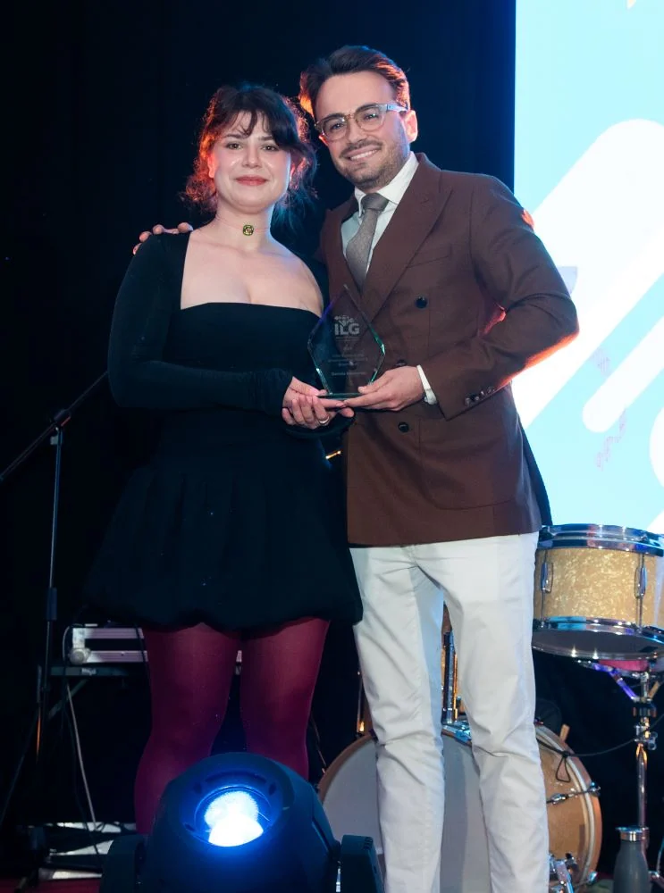 Daniela Naumenko accepting award on stage