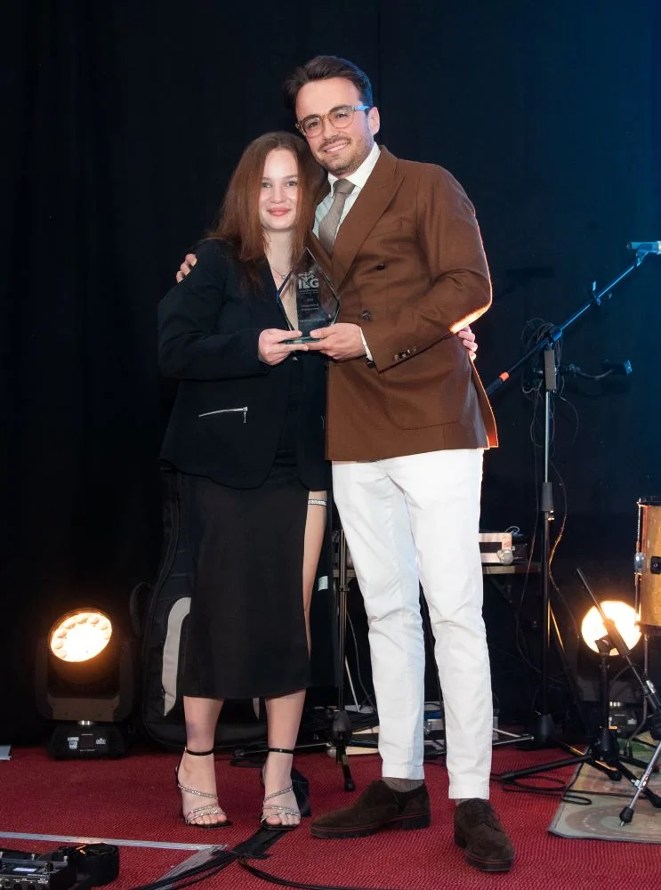 Francesca Bogdan accepting award on stage