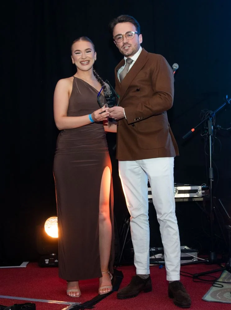 Oliwia Polok accepting award on stage